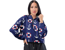 Load image into Gallery viewer, blue women's cropped windbreaker with nautical design of anchors and buoys