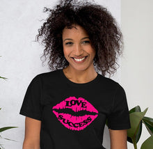 Load image into Gallery viewer, black t-shirt with pink lips and the caption 'love, success' written one on each lip