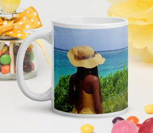Load image into Gallery viewer, 11oz coffee mug featuring a female figure observing the beauty of the Caribbean
