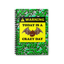 Load image into Gallery viewer, green and white spiral lined notebook with the warning label stating today is a bat shit crazy day with a drawing of a turd with bat wings