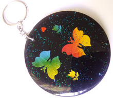 Load image into Gallery viewer, volcanic ash keyring/bag ornament decorated with butterflies and flowers