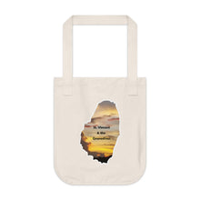 Load image into Gallery viewer, Eco-friendly organic canvas tote bag with a photograph taken of a sunset in St. Vincent and the Grenadines.  The photo is framed in the shape of the mainland of St. Vincent