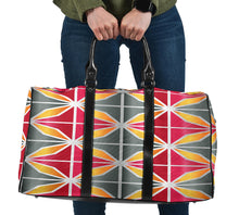 Load image into Gallery viewer, travel bag with pink, grey and orange geometric design.