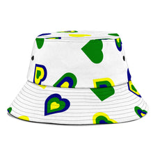 Load image into Gallery viewer, white bucket hat with Vincy Love shown in national coloured hearts.