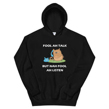 Load image into Gallery viewer, black hoodie with the adage 'fool ah talk but nah fool ah listen' written in the front and an angry cat holding a telephone.