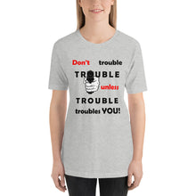 Load image into Gallery viewer, Athletic heather t-shirt sporting the motto 'don't trouble trouble unless trouble troubles you' in black and red letters and a hand holding a gun.