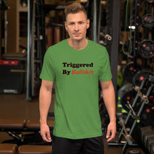Load image into Gallery viewer, leaf-green t-shirt with caption 'triggered by bullshit' in black and green lettering
