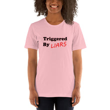 Load image into Gallery viewer, pink t-shirt with caption 'triggered by liars' in black and red lettering