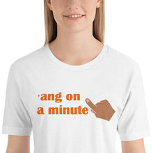 Load image into Gallery viewer, model wearing a white 'ang on a minute t-shirt' in orange letters and with a raised index finger