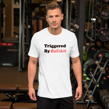 Load image into Gallery viewer, white t-shirt with caption 'triggered by bullshit' in black and red lettering.