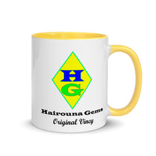 Load image into Gallery viewer, White ceramic mug with yellow inside and on the handle showing the Hairouna Gems logo.