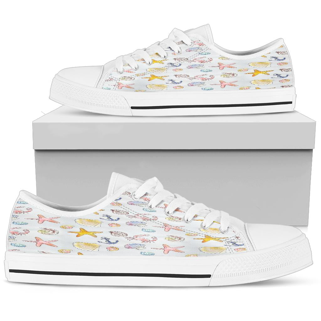 low top canvas shoes with a beach theme including seashells, starfish and anchors