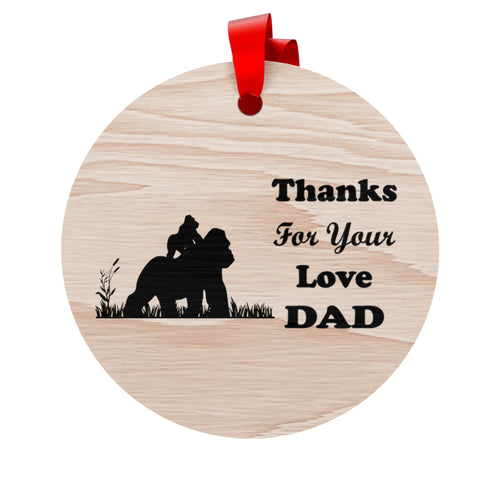 Round plywood Christmas ornament showing a gorilla carrying its baby with the caption 'thanks for your love dad'