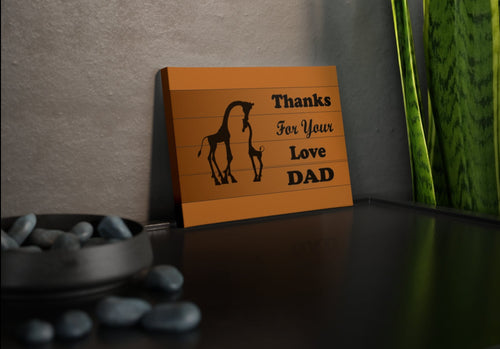 brown canvas photo tile with a silhouette of a giraffe and calf stating thanks for your love dad