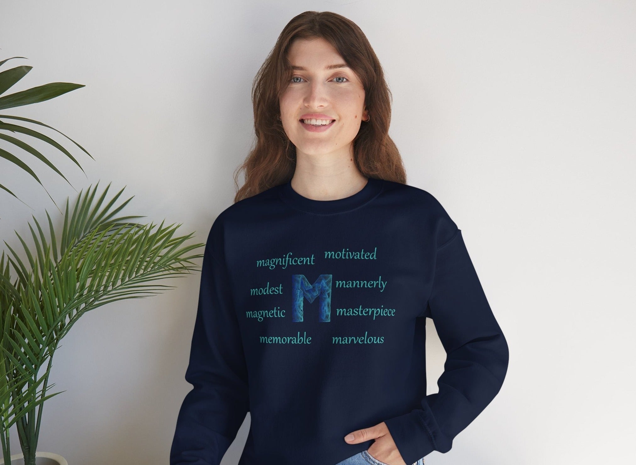 navy blue sweatshirt with the letter M surrounded by motivational m words
