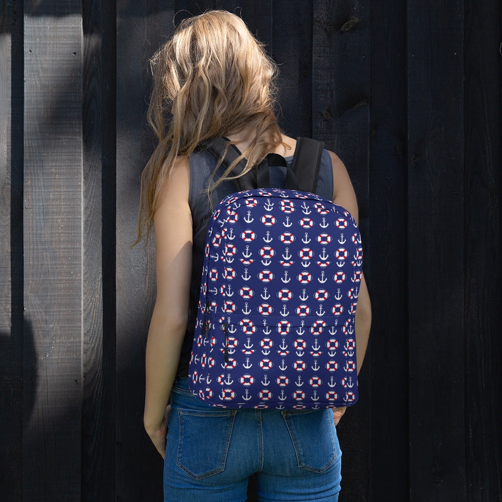 blue unisex backpack with nautical designs of boat anchors and life buoys 