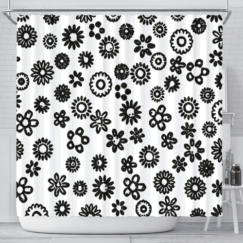 white shower curtain with a variety of black flowers