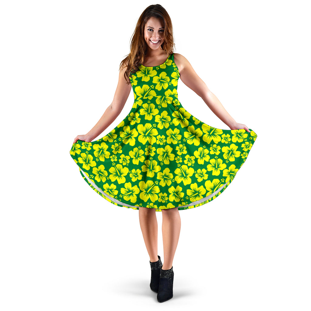 green midi sleeveless dress with yellow hibiscus flowers design.