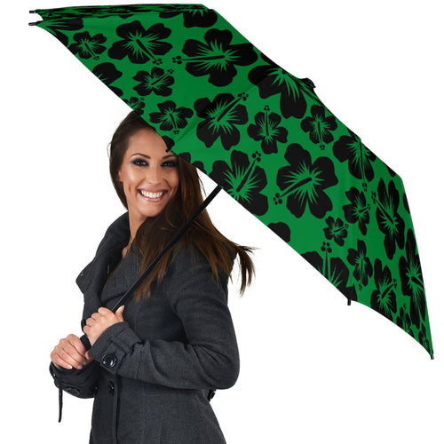 green umbrella with black hibiscus flower pattern