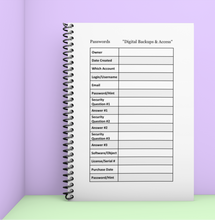 Load image into Gallery viewer, Notebook with password management page on a purple background
