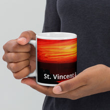 Load image into Gallery viewer, 11oz ceramic mug featuring a photograph of a vibrant sunset in St. Vincent and the Grenadines

