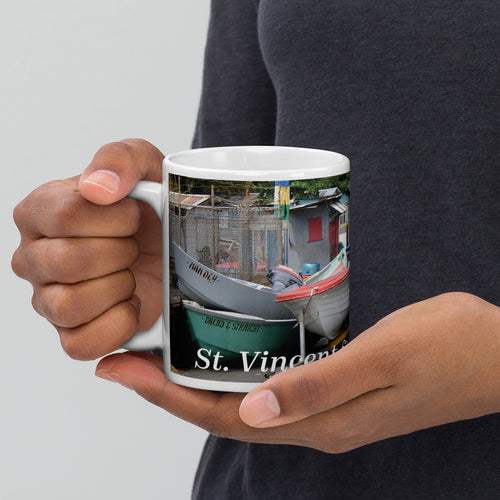 11oz ceramic mug featuring boats placed in the road in Bottom Town to protect them from a storm.