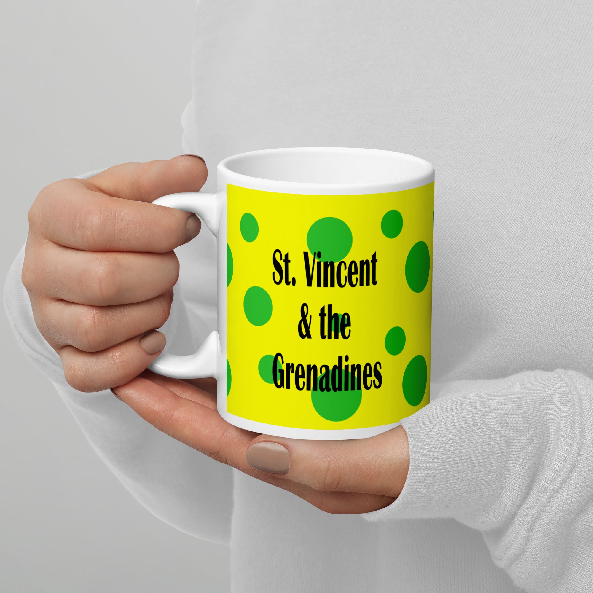 11oz St. Vincent and the Grenadines ceramic mug with green spots on a yellow background