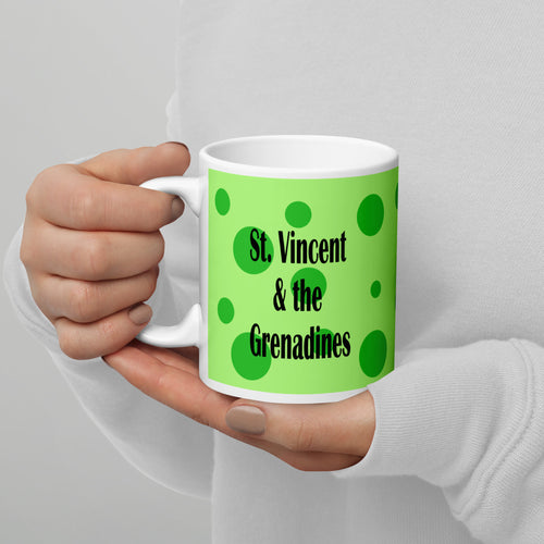 11oz ceramic St. Vincent and the Grenadines mug with green spots on a green background
