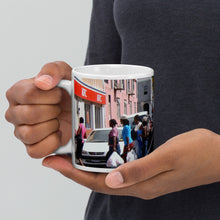 Load image into Gallery viewer, 11oz coffee mug showing a picture of Saturday shoppers in Kingstown, St. Vincent and the Grenadines

