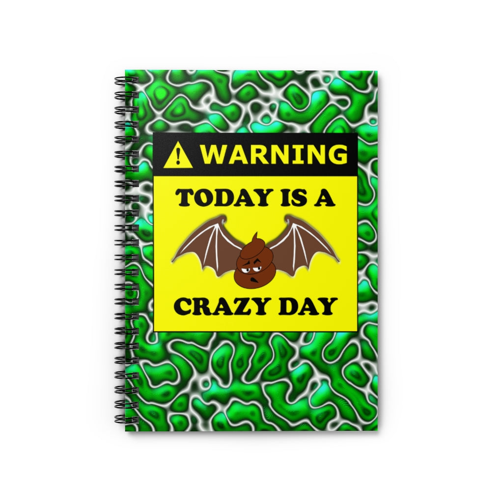 green and white spiral lined notebook with the warning label stating today is a bat shit crazy day with a drawing of a turd with bat wings