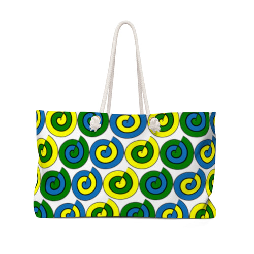 White weekender tote bag with cord handles and blue, yellow and green spirals.