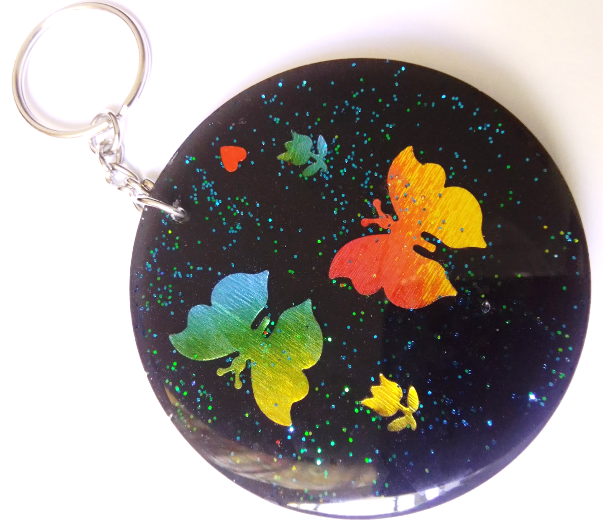 volcanic ash keyring/bag ornament decorated with butterflies and flowers