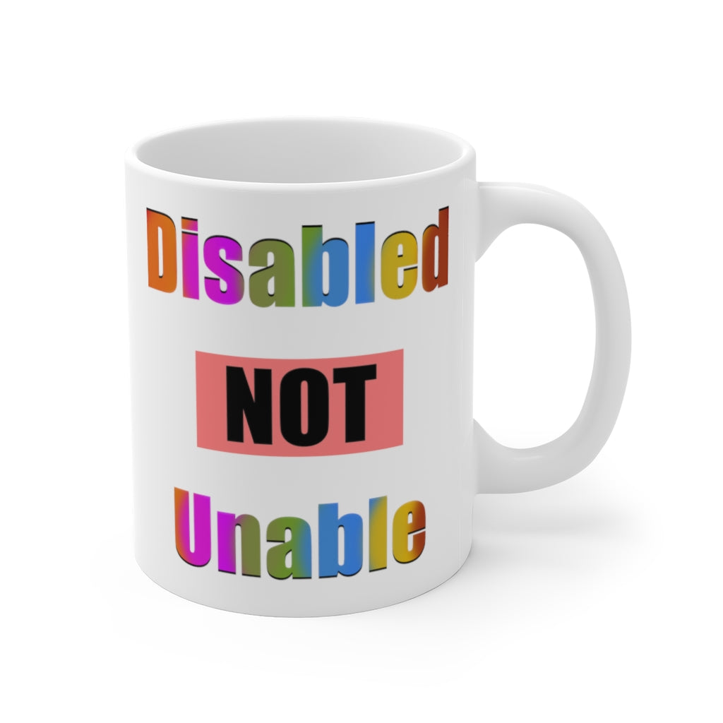 white ceramic coffee mug stating 'disabled not unable' in multi-colored letters