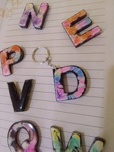 Load image into Gallery viewer, volcanic ash and resin letter keyring decorated with alcohol ink
