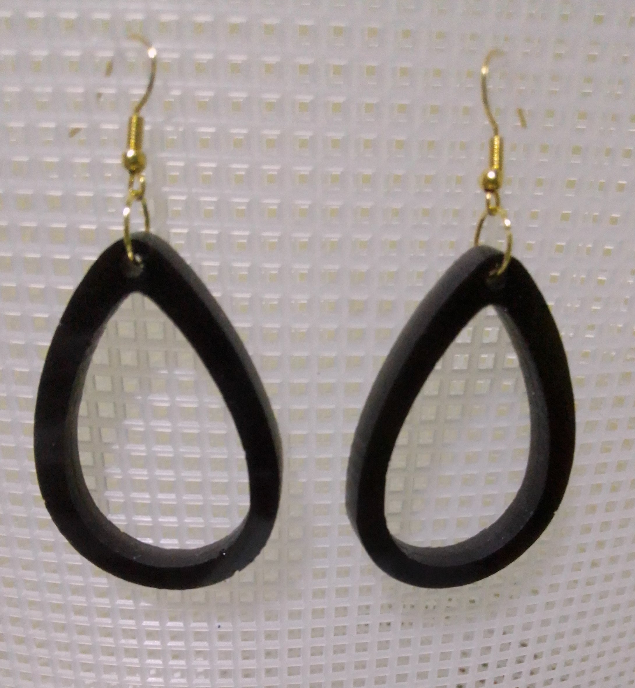 volcanic ash and epoxy resin earrings shaped like a teardrop loop