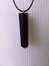 Load image into Gallery viewer, solid black volcanic ash pendant in the shape of a hexagonal prism
