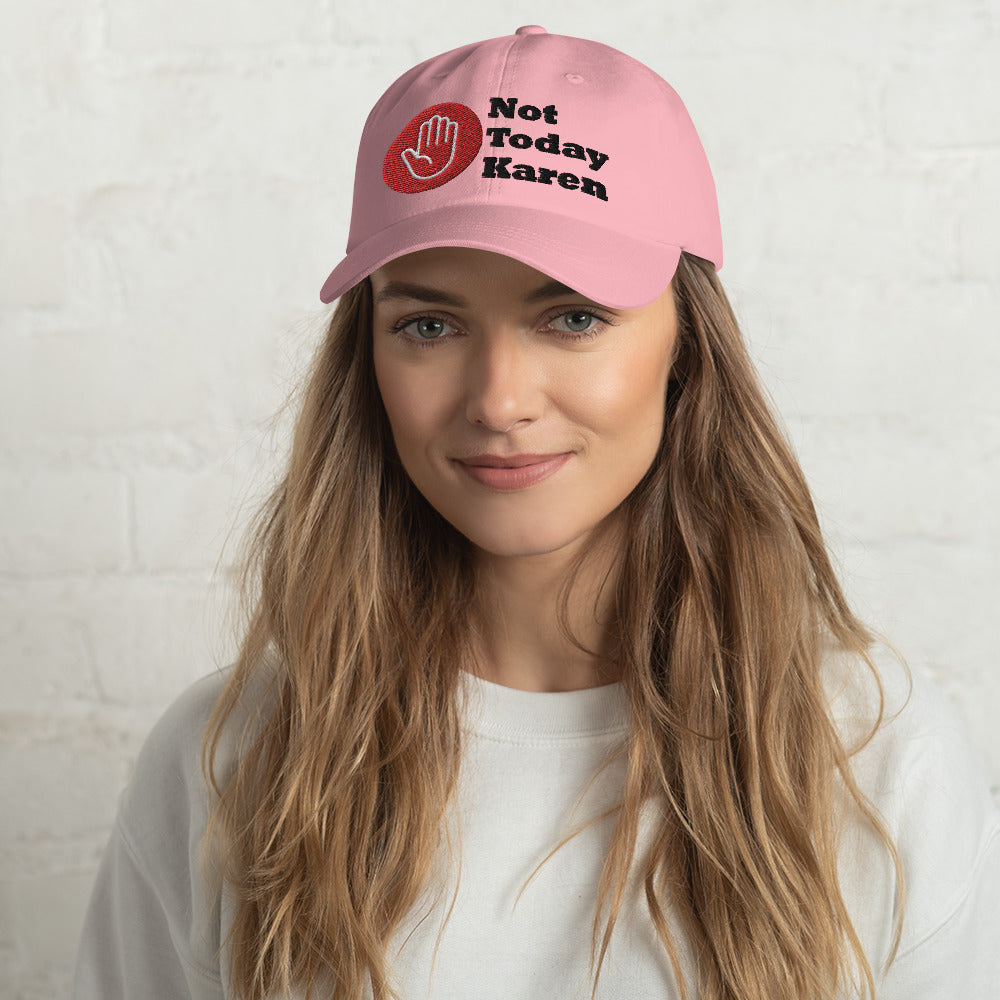 Pink dad hat stating 'not today Karen' and a stop hand in a red circle.