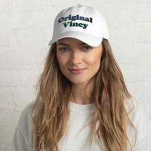 Load image into Gallery viewer, White dad hat with &#39;original vincy&#39; written in camouflage green letters.
