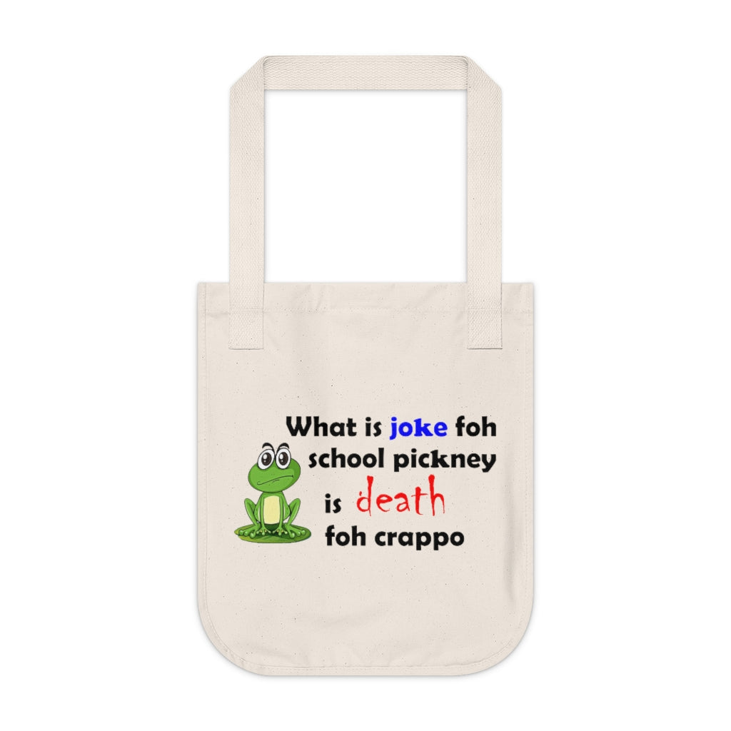 organic canvas tote bag with a drawing of a green frog and the caption 'what is joke foh school pickney is death foh crappo'