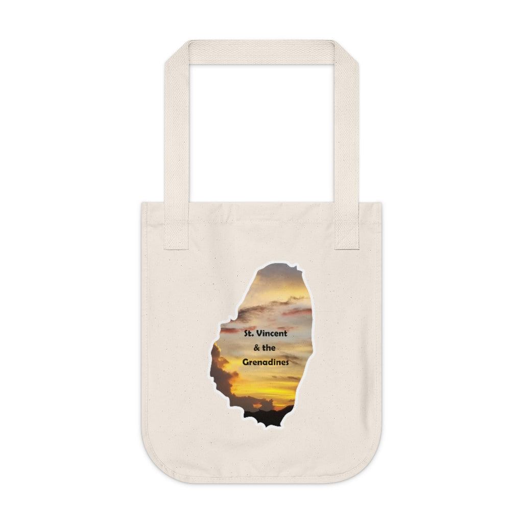 Eco-friendly organic canvas tote bag with a photograph taken of a sunset in St. Vincent and the Grenadines.  The photo is framed in the shape of the mainland of St. Vincent