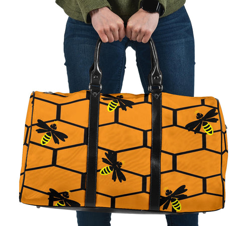 honey colored travel bag with honeycomb and bees design