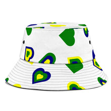 Load image into Gallery viewer, white bucket hat with Vincy Love shown in national coloured hearts. 
