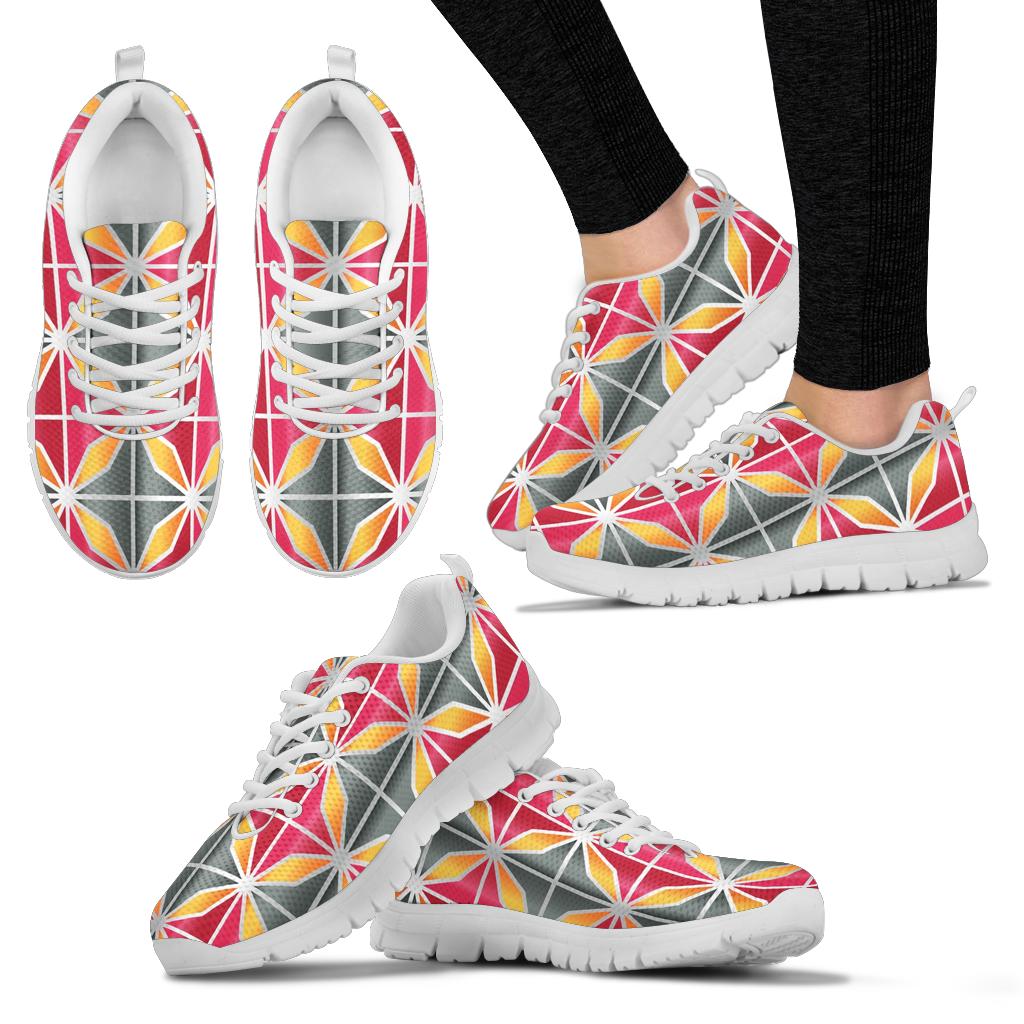 white sneakers with pink, grey and orange geometric design