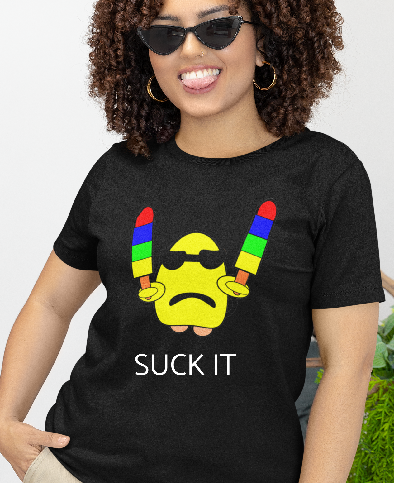 black t-shirt with a yellow gumdrop holding two popsicles and the caption 'suck it'.