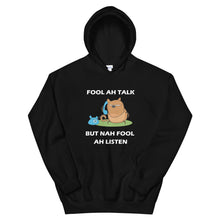 Load image into Gallery viewer, black hoodie with the adage &#39;fool ah talk but nah fool ah listen&#39; written in the front and an angry cat holding a telephone. 
