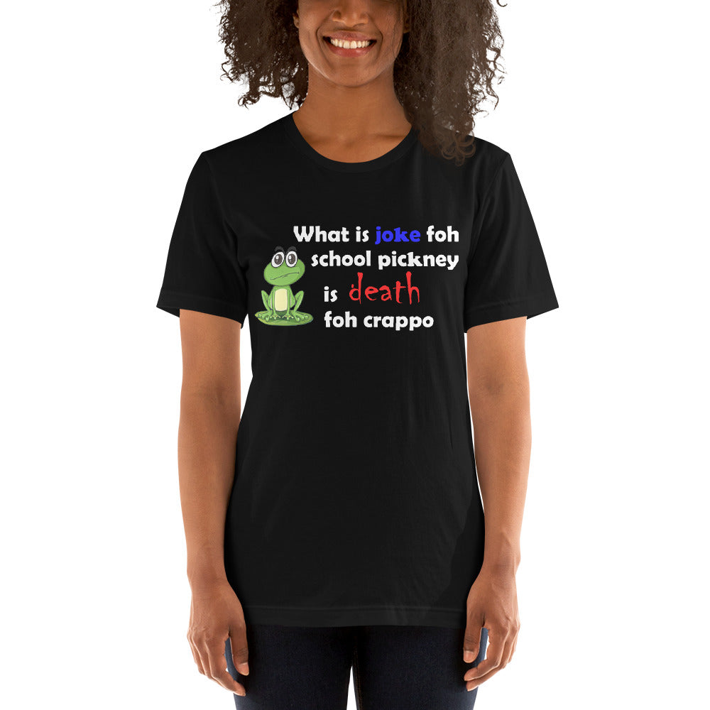 model wearing a black t-shirt with a picture of a frog stating 'what is joke foh school pickney is death foh crappo'. 