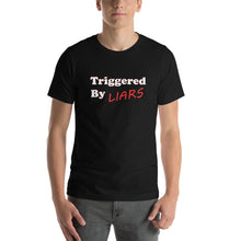 Load image into Gallery viewer, black t-shirt with caption &#39;triggered by liars&#39; in black and red lettering
