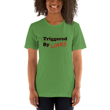 Load image into Gallery viewer, leaf-green t-shirt with caption &#39;triggered by liars&#39; in black and red lettering
